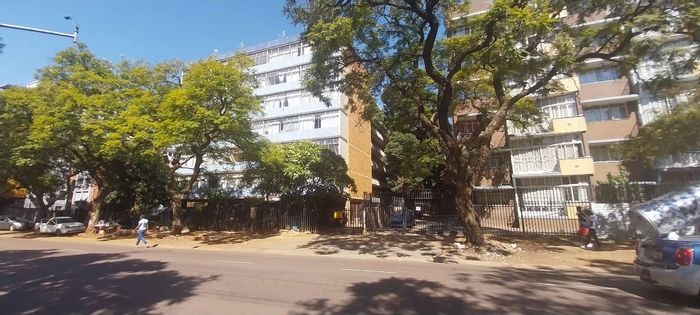 For Sale: Chic Pretoria Central 2BR Apartment with bonus half bedroom, garage. Amenities galore.