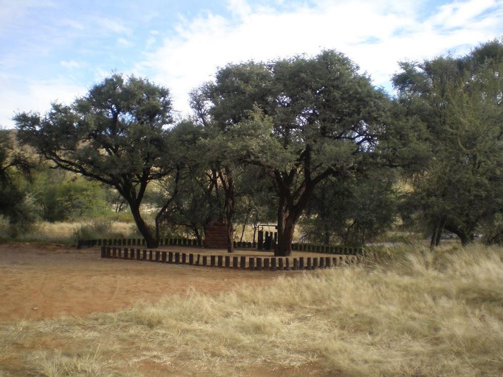 Another campsite with fire place and basin