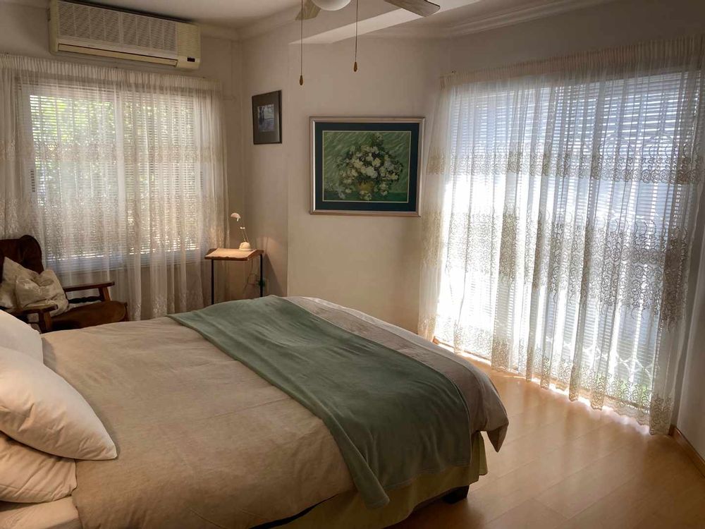 The house offers a spacious main bedroom with a bay-window