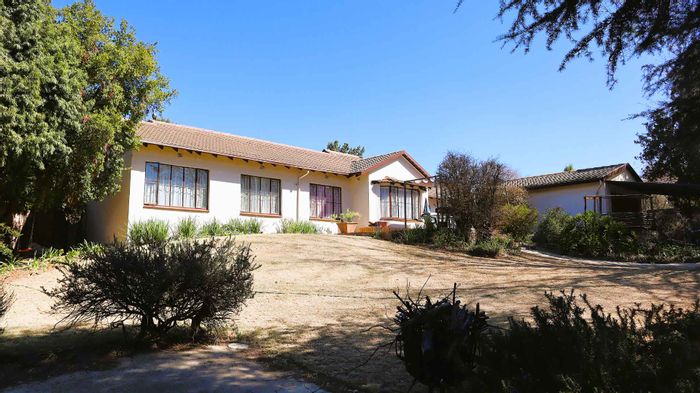 Spacious Four-Bedroom House for Sale in Jukskei Park with Garden and Patio.