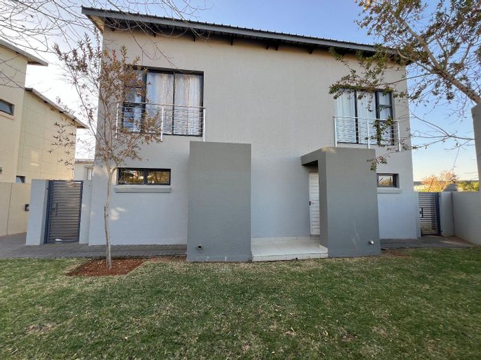 Equestria Townhouse For Sale: Modern 2-Bed, 2-Bath, Large Garden, Double Carports!