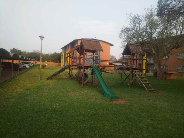 Ground floor apartment for sale in Montana with parking, braai area, and play zone.