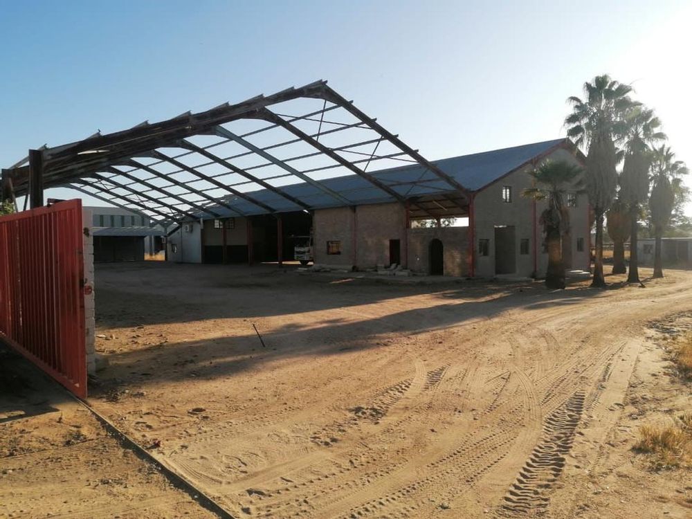 Warehouse/ workshop with incomplete roof and property entrance