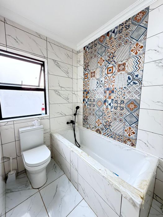 For Sale: Academia House with 4 Bedrooms, Backyard Flat, and Security Features.