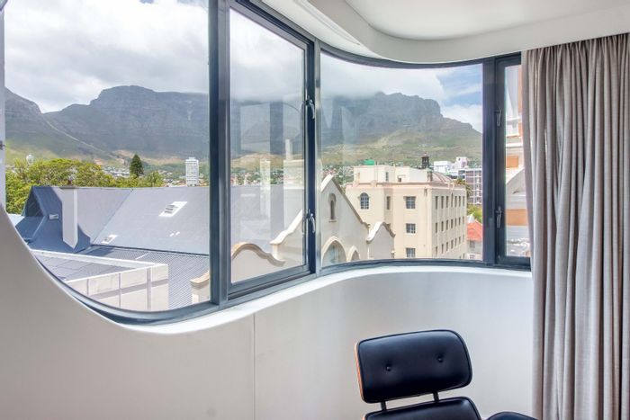 Furnished 2-bedroom apartment with views, security, and parking in Cape Town City Centre.