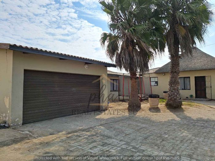 For Sale: House in Walvis Bay Central with flats, garage, and spacious yard.