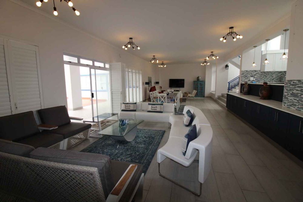 Spacious open living with folding doors to create a panoramic sea view. 