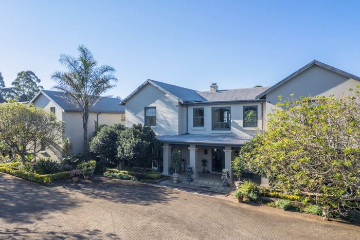 Equestrian house for sale in Assagay with stables, pool, and expansive gardens.