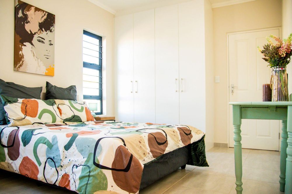 Main bedroom with built-in cupboards & ensuite.