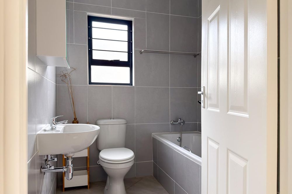 Family bathroom with bath.