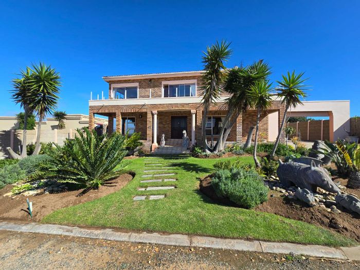 Spacious house in Still Bay West with pool, flatlet, and ample parking. For Sale.
