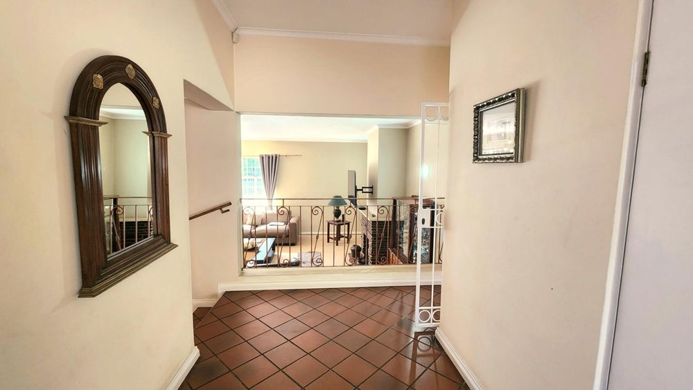 Entrance hall from front door.  Guest toilet to the right.