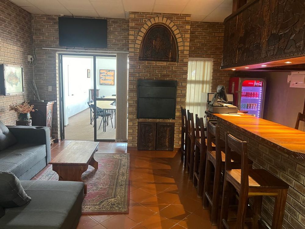 Bar with seating area. The conference room is through the sliding door