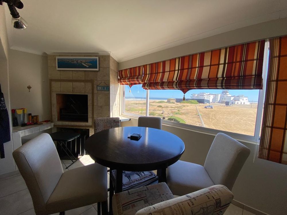 Indoor BBQ and view of the ocean from the lounge