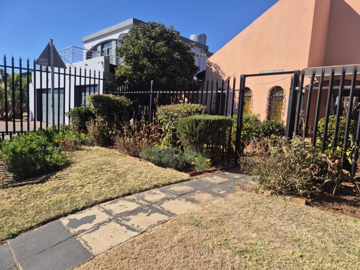 For Sale: Spacious 4-Bedroom House in Lenasia Ext 1 with Flatlet Potential.