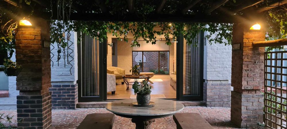 Outdoor covered patio to TV Room and inner garden