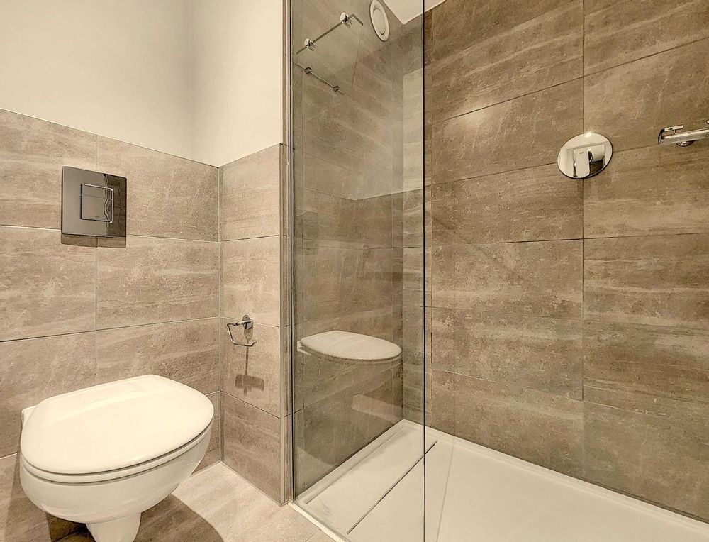 Bathroom with a shower, toilet, and sink
