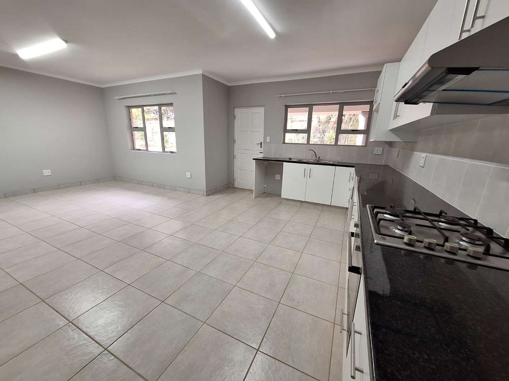 Kitchen open plan into 2nd living area (dining)