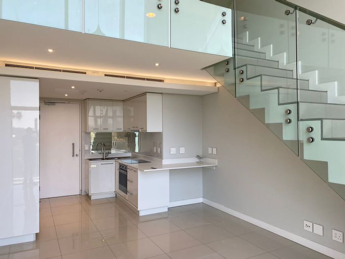 To Rent: 1-Bedroom Apartment in Rosebank with rooftop pool, gym, and security.