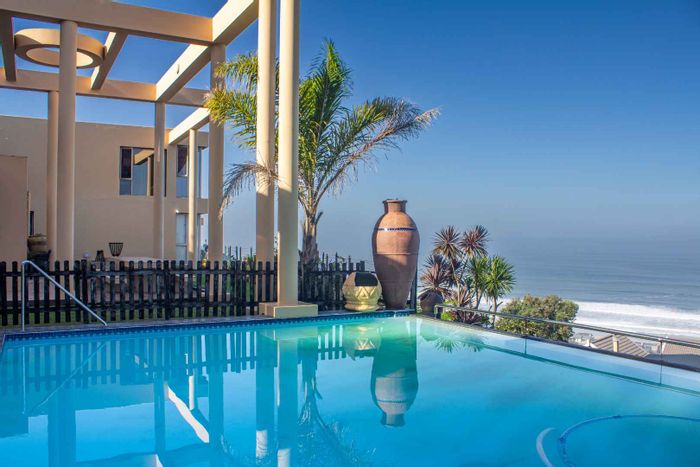 For Sale: House in Outeniqua Strand with sea views, theater, and rental units.