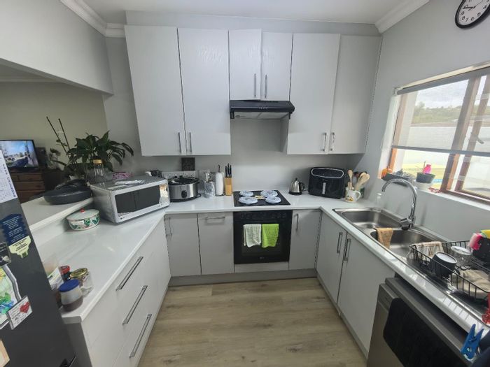 Townhouse For Sale in Fairbridge Heights: 2 beds, 2 baths, covered parking, private outdoor space.