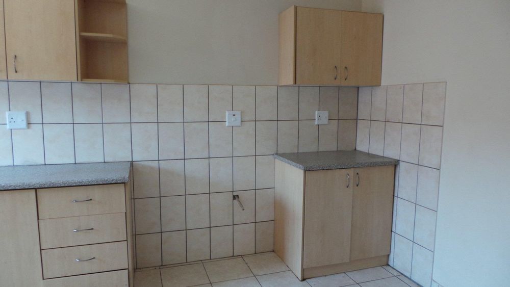 Kitchen with laundry and stove fittings