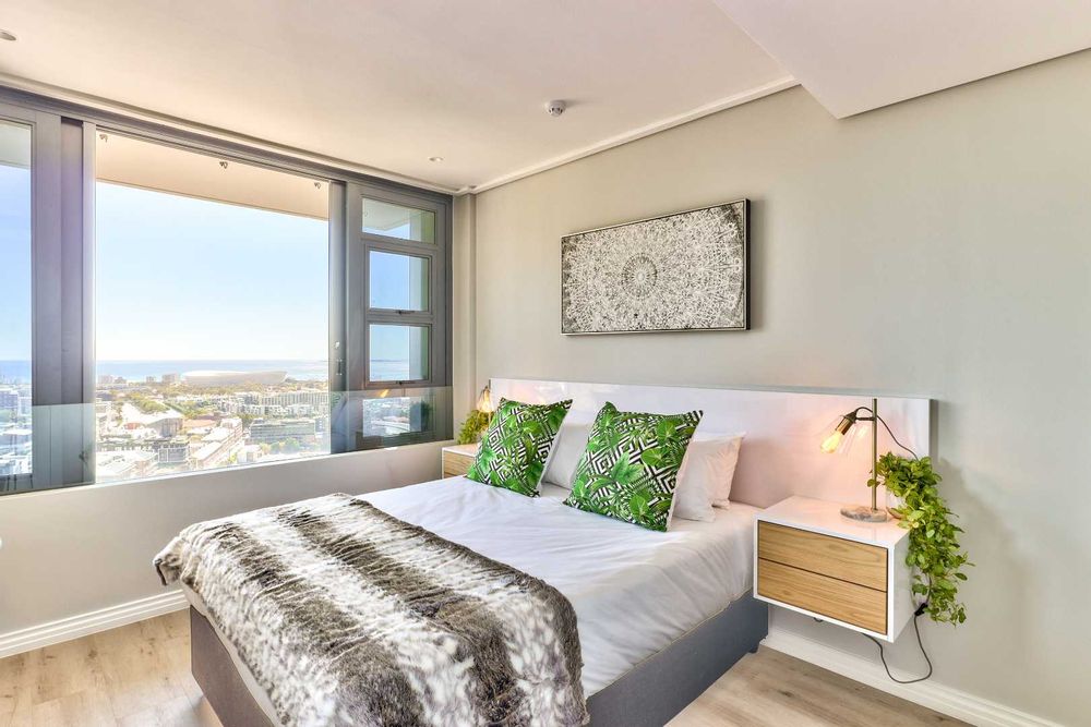bedroom with with table bay views