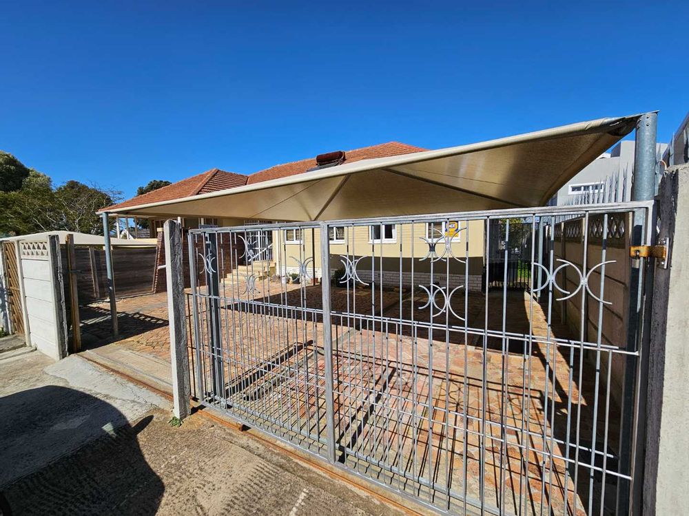 2 x covered parking behind manual gate