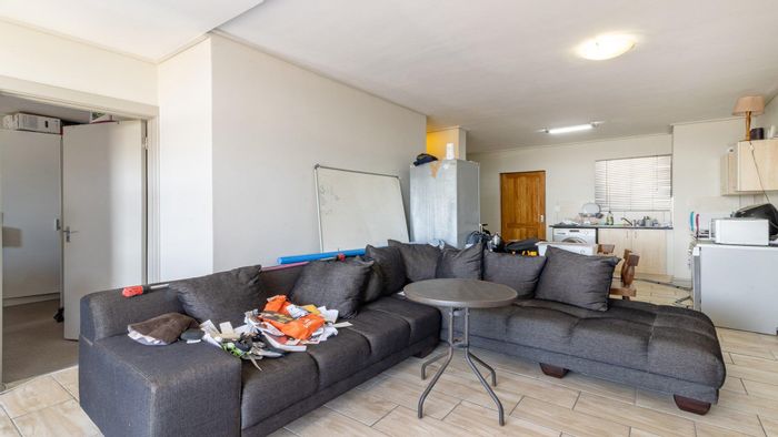 For Sale: Apartment in Milnerton Central with balcony, en-suite, and functional kitchen.