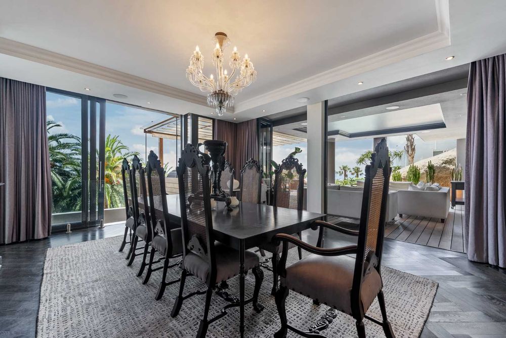 Spacious dining room, enjoying natural light, views and easy access to the kitchen and outdoor entertainment areas.  Oggie floors.