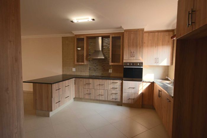 3-Bedroom Townhouse in Olympus To Rent with Garden, Garage, and Security Features.