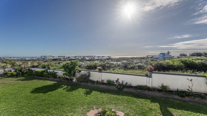 For Sale: House in Grotto Bay Central with sea views, dual family living, and security.