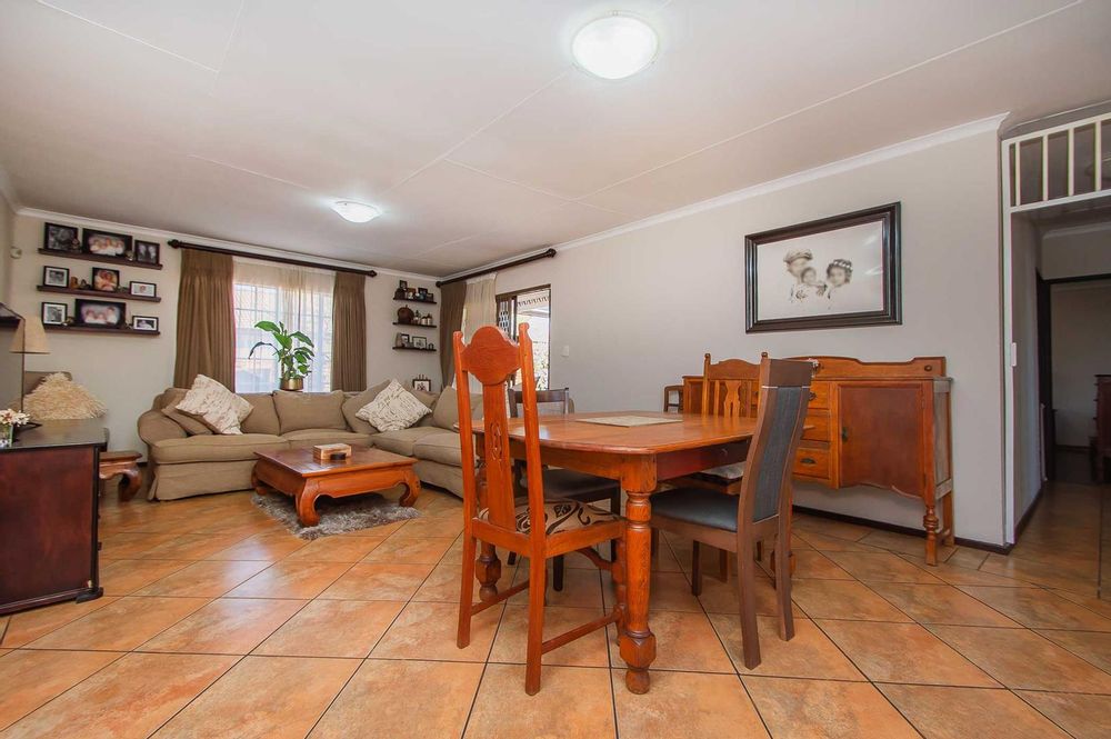 Spacious reception area with neutral tiles 