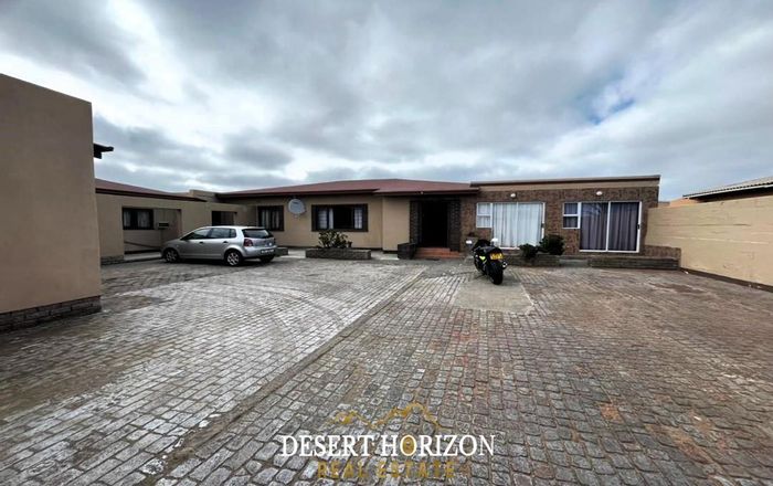 Spacious house with flat, parking, courtyard, and close to amenities in Walvis Bay Central. For Sale.