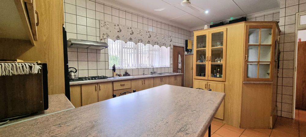 Spacious kitchen with hidden laundry area