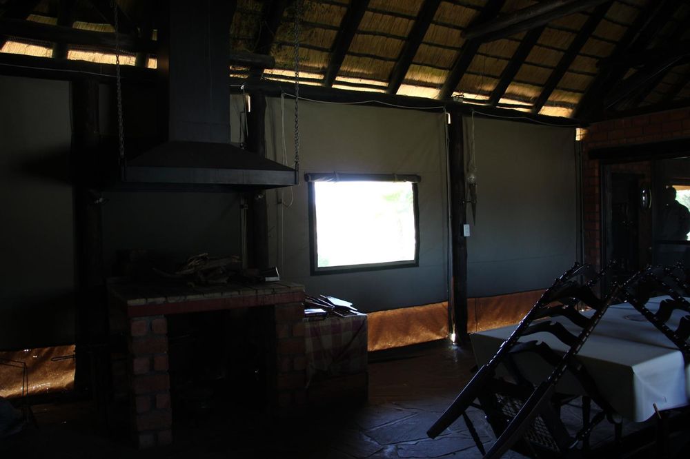 Outdoor/ enclosed entertainment room with indoor BBQ