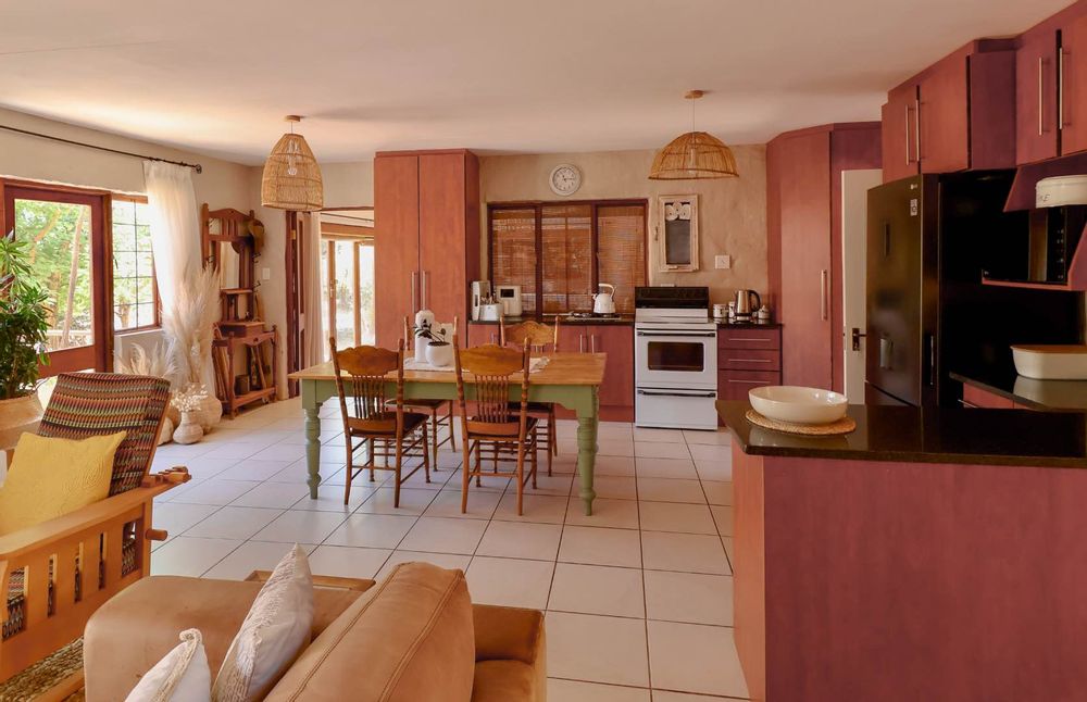 Open-plan lounge and kitchen with dining area