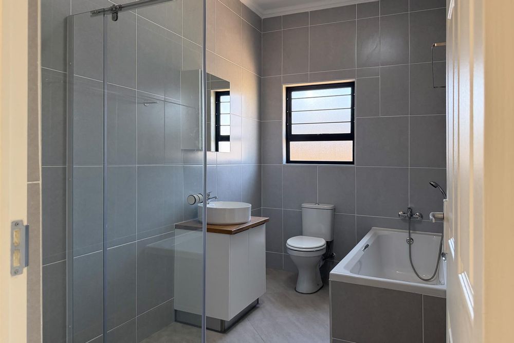 Family bathroom with both bath & shower.