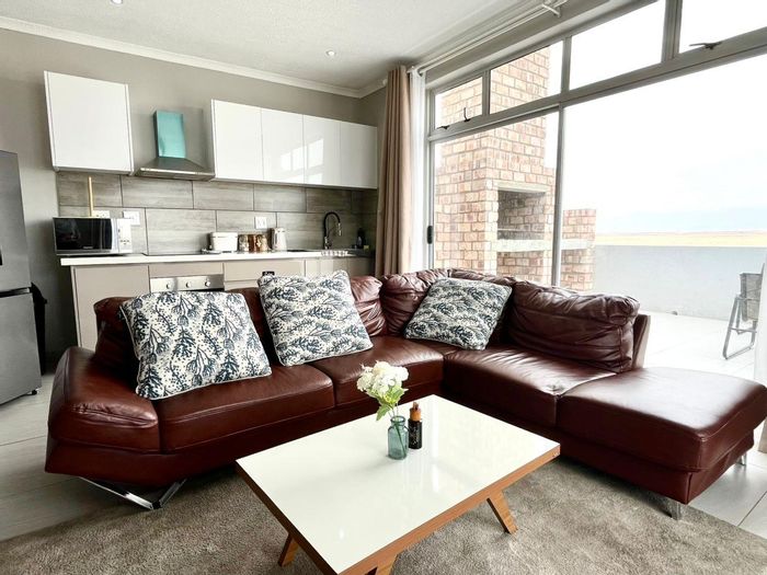 For Sale: Ocean View Apartment with 3 en-suites, balcony, and garage.