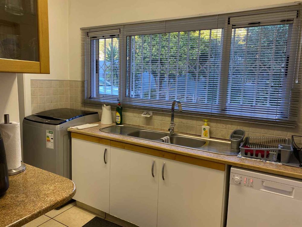 The scullery/laundry opens up onto a drying yard