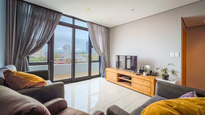 For Sale: Beachfront Apartment in Umhlanga Rocks Central with sea views, security, amenities.