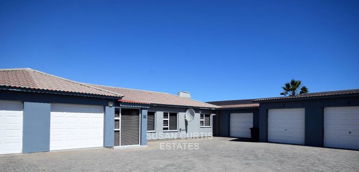 For Sale: Meersig Townhouse with bachelor flat, double garage, and spacious living areas.