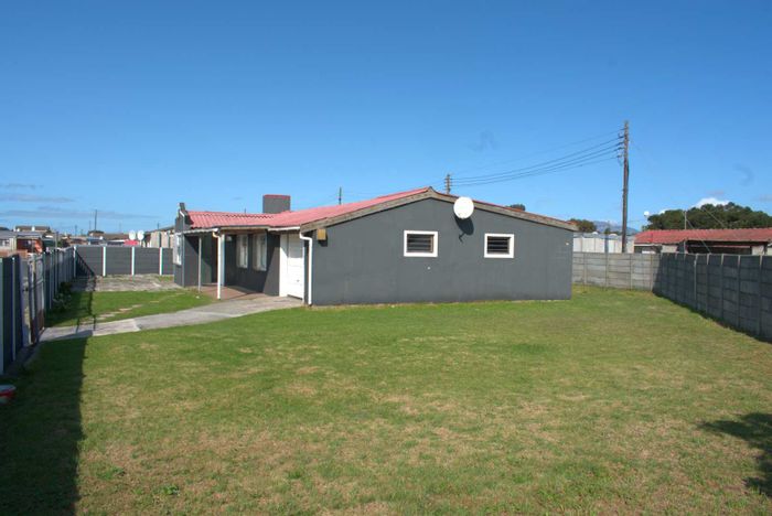 House for Sale in Manenberg: Spacious living, secure parking, and extension potential.