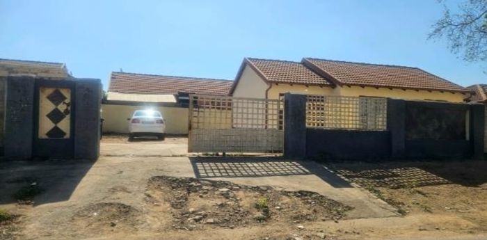 For Sale: 2-bedroom house in Lotus Gardens with spacious yard and parking options.