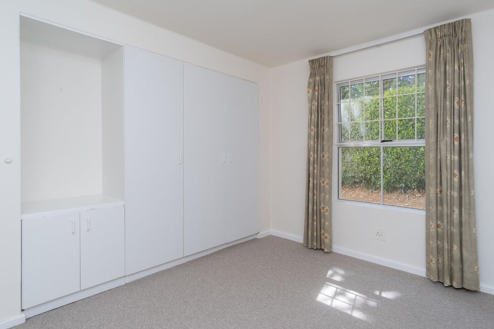 Bedroom 1 with fitted cupboards