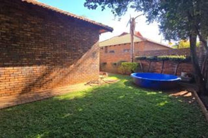 For Sale: Townhouse in Doornpoort with 3 bedrooms, garden, and double garage.