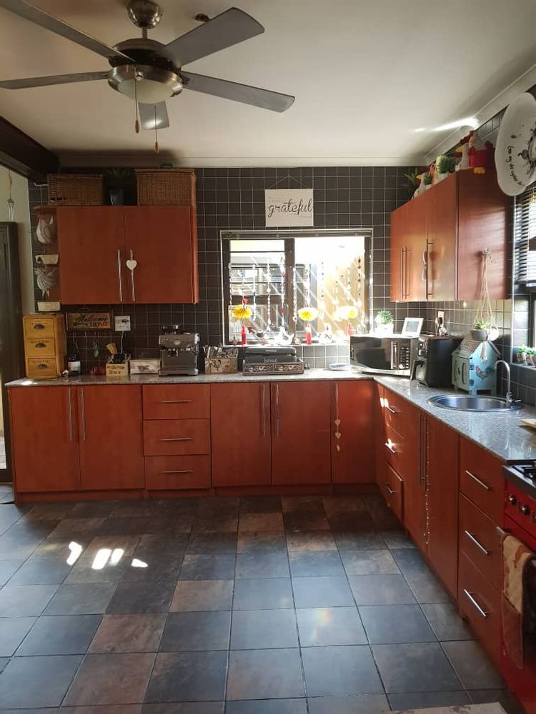 The kitchen is spacious with lots of cupboards