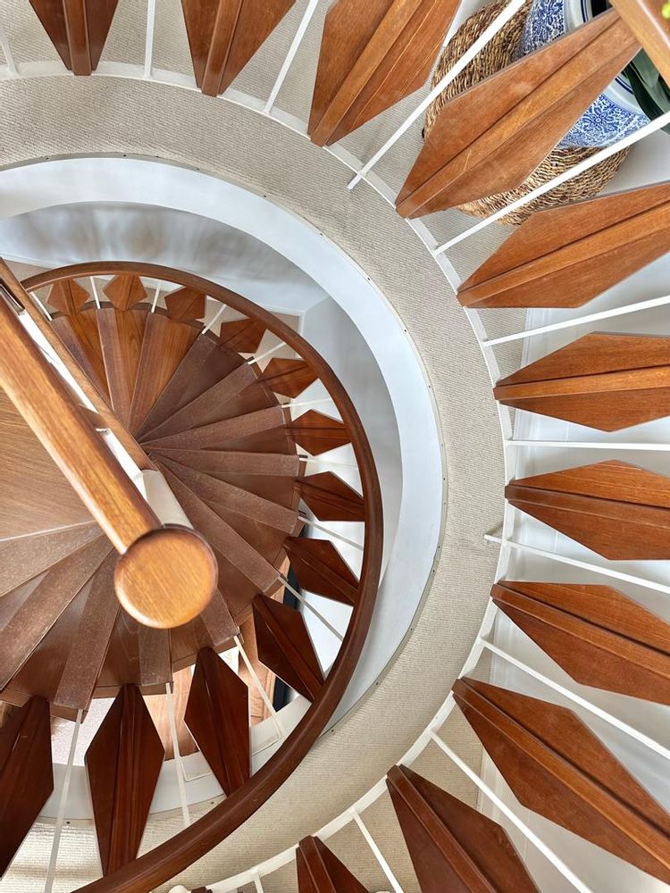 spiral staircase leading down to office and second bedroom