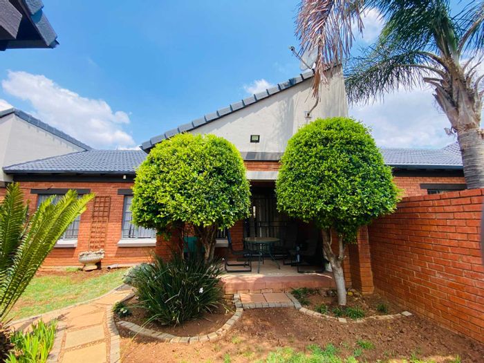 For Sale: Mooikloof Townhouse with private garden, double garage, and estate amenities.