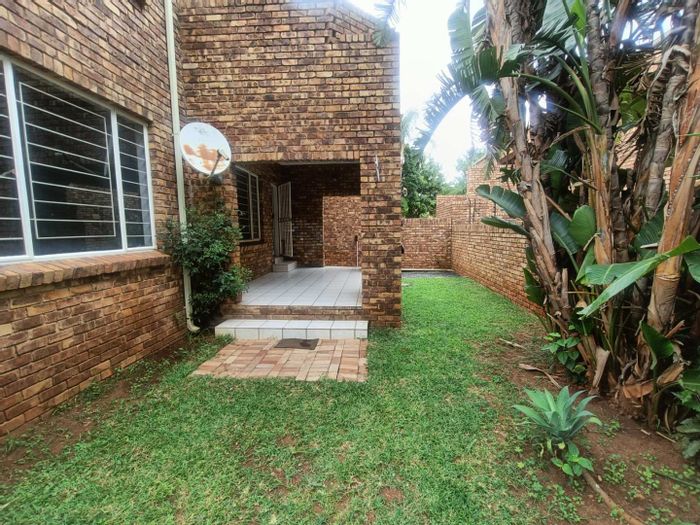 Townhouse to rent in Zwartkop Ext 7: 3 beds, 2 baths, garden, double garage.